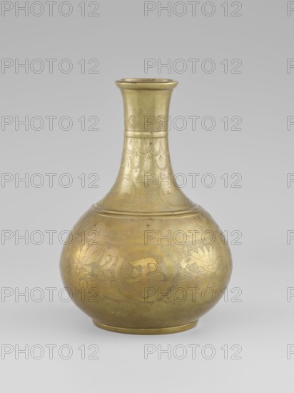 Vase — bottle, maker, 19th century China, Qing dynasty 1644–1911; porcelain vessel on a very low ring-shaped foot; decorated with plant ornament: peonies; height 20.9 cm, diameter 15.38 cm., A rounded metal vessel with a narrow neck and flared rim sits against a neutral gray background; the vessel is golden in color with slightly darker golden engraved decorative patterns covering its surface, including floral and curved motifs; the body is bulbous with a smooth base, the neck tapers upward and shows repeated scalloped and feather-like engraved designs, and the rim is slightly darker gold than the body; overall the visible colors are shades of gold and gray.