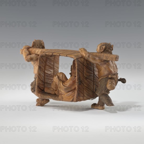 Okimono in the shape of Oni and Shôki, unknown sculptor, Japanese, Meiji 1868–1912, early 20th century, subject: mythology/demons, Shôki, sculpture okimono, height 9.1 cm, width 16.0 cm., A carved wooden sculpture showing a group of figures arranged around a central cabin-like form, all rendered in warm brown and tan wood tones with visible grain and carved texture; two standing figures at opposite ends hold a horizontal beam across their shoulders and have muscular arms and carved hair, while a reclining figure nestles inside the cabin with draped clothing and detailed folds; the cabin walls display carved panels with repeating textured patterns and the figures wear carved accessories and garments with varied surface detail; the scene sits on a light gray surface with a gradient gray background, and the overall colors visible are shades of brown, tan, gray, and a touch of darker brown in shadowed areas.