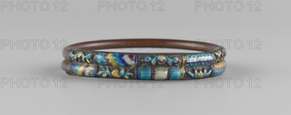 Bracelet, ornaments, Chinese art, Chinese culture, women's ornaments, Qing 1644–1911, plant ornament, enamel colors: white, yellow, teal, blue, 19th century, China, jewelry, diameter 7.0 cm, A circular metal bracelet with a dark base and a polished inner ring, decorated along its outer band with a repeating raised pattern featuring floral and geometric motifs in a range of colors including blue, turquoise, purple, yellow, gold, and hints of white, with areas of iridescent sheen and subtle wear on the darker metal.