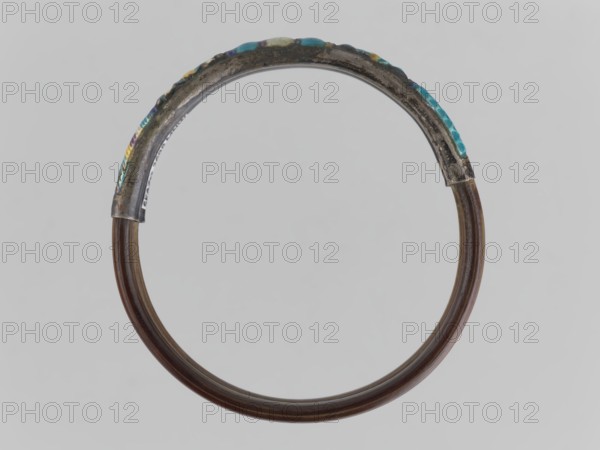 Bracelet, gift, ornaments, Chinese art, Chinese culture, women's ornaments, Qing 1644–1911, plant ornament, enamel colors: white, yellow, teal, blue, 19th century, China, jewelry, diameter 7.0 cm, A circular bracelet with a smooth dark brown lower portion and a textured upper metal section showing patina and areas of turquoise, blue, yellow, purple, and green, set against a pale gray background.