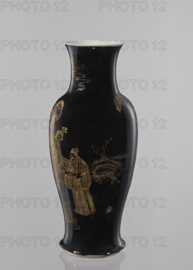 Vase, Elongated vase with a wide neck. Decoration painted with gold on a black background; figural decorations and figural scenes set against a landscape background, gilding. Chinese, Qing style Qing, 1644–1911, 19th century. Ceramic vessel. Height 43.7 cm; diameter 18 cm., A tall, slender vase with a flared rim and a gently curved body, finished in a glossy black surface with gold-painted decorative scenes and motifs; the rim interior appears pale, and there are gold-painted figures and landscape elements including a robed standing figure, stylized trees, and cloud- or wave-like patterns. Colors visible include black, gold, and a pale off-white at the rim.
