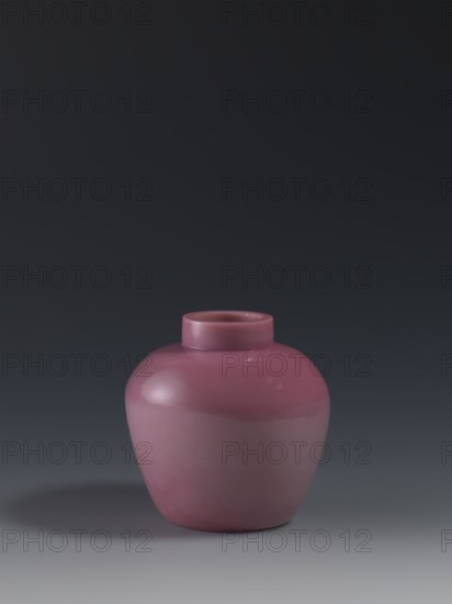 Ginger vessel, Chinese, Qing dynasty 1644–1911, ovoid storage pot with a short collar, mid-19th century, vessel, height 11.5 cm, diameter 11.5 cm, weight 0.46 kg., A rounded ceramic vase with a short neck and narrow opening sits centered against a smooth gradient background; the vase is a dusty rose to mauve color with glossy highlights and subtle reflections, and it casts a soft grayish shadow on the surface beneath.