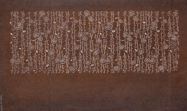 Katagami dyeing stencil with a leaf motif on branches eda ni ha moyô, Japanese, Edo 1603–1868–Meiji 1868–1912, 19th century, chuban format, stencil, leaves and branches motif, height 41.2 cm, width 24.9 cm, A rectangular surface in shades of brown with a lighter brown band along the top and a darker brown area below, featuring a horizontal strip near the top filled with a repeating white floral pattern of vertical stems, small leaves, and rounded flower shapes, on the left edge a small vertical area with faint markings in white.