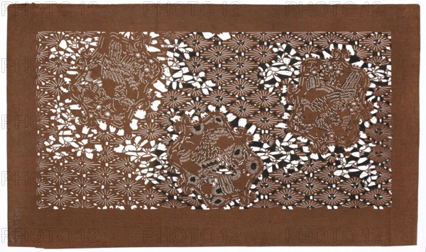 Dyeing stencil katagami with a motif of rhomboidal flower rosettes and birds hanabishi ni tori moyô, ise-katagami, stencils, chuban format, kachoga iconography: birds, flowers, plum trees, hanabishi pattern, geometric and plant patterns. Pattern cut out on the pattern: against the background of a grid of flower rosettes enclosed in rhomboids, quadrilateral reserves with a pair of doves and a small plant motif., 19th/20th century Meiji period, Japan. Template; height 41.5 cm, width 24.3 cm., A rectangular sheet of brown paper with an intricate cutout pattern fills most of the image, showing a repeating floral-like lattice with many daisy-shaped motifs and organic, curving gaps; within this lattice are three ornate cartouche shapes each containing a stylized bird rendered by delicate cut lines and feather details; the cutwork reveals white background through the negative spaces, creating high contrast with the brown paper and occasional small areas of dark shadow where layers overlap, an...