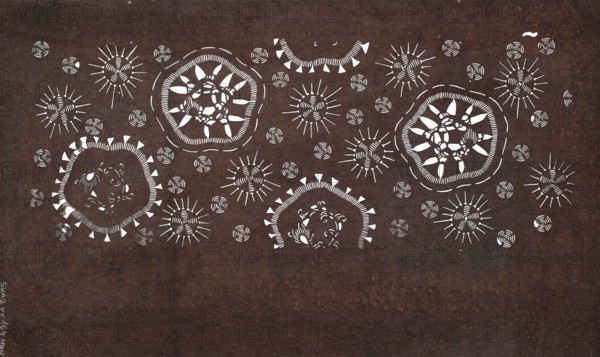 Katagami dyeing stencil with a motif of stylized flower and snow rosettes kawari hanabishi ni yukiwa moyô, ise-katagami, chuban format, geometric and plant patterns, stencil, Japanese, Meiji period 2nd half of the 19th century, height 40.9 cm, width 24.3 cm, A dark brown textured background fills the image with a pattern of white decorative circular and sunburst shapes arranged across the upper half; several larger rounded organic rings contain petal-like and spiral motifs, while a group of smaller circular spirals and radiating line sunbursts are scattered between them, creating a repeating ornamental design.