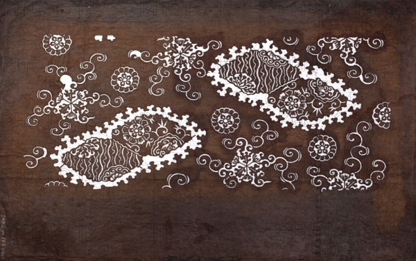 Katagami dyeing stencil with a motif of stylized rhombuses with flowers and round floral motifs kawari bishi ni hana to hanamaru moyô, Meiji period 1868–1912, katagami stencil, chuban format, geometric-floral patterns, flowers, 19th–20th century Meiji period, Japan, stencil, height 41.0 cm, width 25.2 cm, The image shows a textured, mottled brown background with a series of ornate white decorative motifs scattered across it, including floral shapes, swirling curlicues, and two large leaf-like patterned clusters with scalloped edges; the white designs contrast with the various shades of brown in the backdrop.