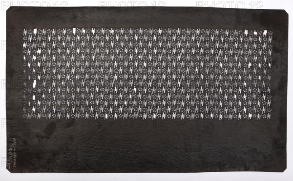 Katagami dyeing stencil with plum blossom and stylized mist motif ume no hana ni kasumi moyô, katagami stencil, chuban format; geometric and plant patterns, flowers, plum trees; stencil; Meiji period, 2nd half of the 19th century Japan; height 40.3 cm, width 23.7 cm., A large rectangular sheet with a dark brown to almost black surface fills the image, showing a patterned central panel of cut-out shapes that reveal a white background beneath; the cut-outs form a repeating decorative motif across a horizontal band near the top, leaving a broad plain darker area below. The patterned band displays a grid of small floral-like shapes and narrow vertical slits, creating a high-contrast interplay of white and dark. The sheet has slightly irregular edges with small corner bevels and subtle surface texture variations, including faint lighter spots and scuffs. Overall the visible colors are dark brown to black for the sheet and white showing through the pattern.