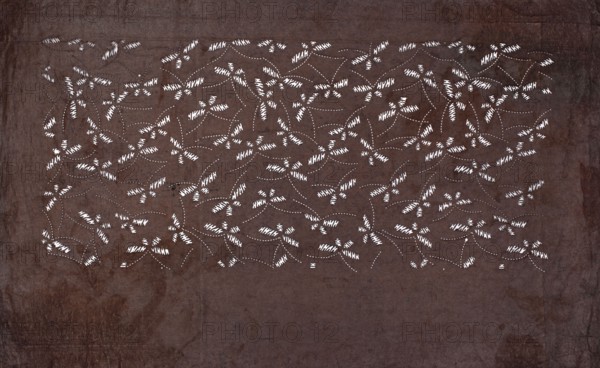 Dyeing stencil katagami cut into a swarm of butterflies; maker, 19th century, Japan; ise-katagami; stencil; height 41.0 cm, width 25.3 cm; Japanese art; butterflies; materials/technique: dyeing stencil., A large rectangular dark brown surface fills the image with a textured, mottled appearance and slightly darker edges; across the upper central area there is a dense pattern of small white short marks and white dotted curved lines forming repeating cluster shapes, creating an overall lace-like or stitched appearance against the brown background.