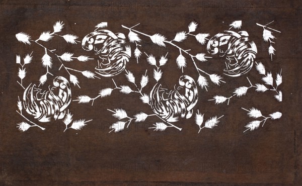 Dyeing template katagami cut into a stylized plant ornament; maker, Japanese; Meiji period 1868–1912; templates, katagami; plant ornament design; late 19th/early 20th century; Japan; template; height 40.3 cm, width 24.7 cm, A dark brown background fills the image with a repeating pattern of white stylized organic shapes resembling curled forms and branched stems with feathery leaf clusters scattered across the surface, showing a contrast between the white elements and the brown backdrop; the white shapes form several curled, decorative motifs and a group of branched stems with feathery leaves arranged across the upper and middle areas, with a few isolated leaf clusters toward the edges.