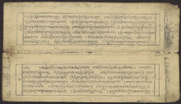 Buddhist text — Prayer for rebirth in the pure land of Sukhavati by master Raga Asja the first reincarnation of the Karma Chagme lineage, unknown creator role/classification, Buddhist art, Tibetan; graphic prints; prayer text; Buddhist book of the pecha type; xylographic print in disciple script dbu can; top edge tied with string. Leaf numbering on recto; 16 folios in total, 15 numbered with text, the last blank. 15th folio verso handwritten in pencil in Ume script dbu med; 16th folio verso handwritten in ink upside down in students’ scripts and Ume. The original prayer text by master Raga Asja Tib. ra ga a syas, the first tulku of the Karma Chagme Tib. kar ma chags med reincarnation lineage, dates from the 17th century. 19th century object, Tibet. Graphic; height 30.5 cm, width 8.6 cm., A horizontal image of an aged, folded paper sheet with a dark background, showing two rectangular bordered blocks each containing dense lines of handwritten script in dark ink; the paper is a yellowed ...