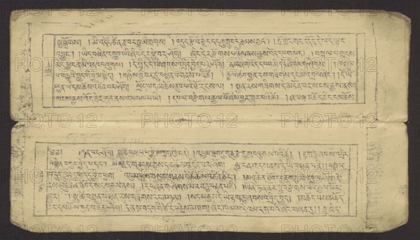 Buddhist text - Prayer for rebirth in the pure land of Sukhavati by master Raga Asja the first reincarnation of the Karma Chagme lineage, unknown creator role/classification, Buddhist art, Tibetan, graphic prints, prayer text, Buddhist book of the pecha type, xylographic print in disciple script dbu can, top edge tied with string. Leaf numbering on recto, 16 folios in total, 15 numbered with text, the last blank. 15th folio verso handwritten in pencil in Ume script dbu med; 16th folio verso handwritten in ink upside down in the scripts of students and Ume. Original prayer text by master Raga Asja Tib. ra ga a syas, the first tulku of the Karma Chagme Tib. kar ma chags med reincarnation lineage, dates from the 17th century. 19th century, Tibet. Graphic; height 30.5 cm, width 8.6 cm., A horizontal rectangular image showing an aged, folded paper manuscript with a dark background; the paper is a faded yellowish-beige with visible wear, creases, and smudges, and there are two long, narrow r...