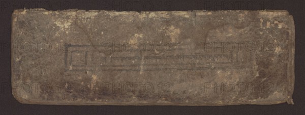 Buddhist text - Commentary on the praise of the names of Manjushri by Ga Rabjampa Kunga Yeshe Tib. 'phags pa 'jam dpal gyi mtshan yang dag par brjod pa zhugs so, Buddhist art, Tibetan, graphic prints, Book in Tibetan pecha style, xylographic print in student script dbu can. 26 folios, recto page numbering, first verso, 2 pages missing. Buddhist commentary on the prayer of praise in honor of the names of the bodhisattva Manjushri Tib. 'jam dpal dbyang by Ga Rabjampa Kunga Yeshe Tib. sga rab 'byams pa kun dga' ye shes. Original text from the 15th century; object dated 19th century, Tibet. Graphics; width 24.6 cm, height 8.0 cm., A worn rectangular object with rounded corners resting on a dark background, showing a rough, textured surface in shades of brown, tan, and muted gray with areas of lighter beige spotting and darker brown discoloration; there is a faint rectangular impression near the center with subtle linear markings and slightly darker brown lines, and the edges show fraying a...