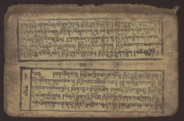 Buddhist text - Commentary on the praise of the names of Manjushri by Ga Rabjampa Kunga Yeshe Tib. 'phags pa 'jam dpal gyi mtshan yang dag par brjod pa zhugs so, Buddhist art, Tibetan, graphic prints, Book in Tibetan pecha style, xylographic print in student script dbu can. 26 folios, recto page numbering, first verso, 2 pages missing. Buddhist commentary on the prayer of praise in honor of the names of the bodhisattva Manjushri Tib. 'jam dpal dbyang by Ga Rabjampa Kunga Yeshe Tib. sga rab 'byams pa kun dga' ye shes. The original text comes from the 15th century; this object: 19th century, Tibet. Graphics, width 24.6 cm, height 8.0 cm, An aged rectangular page with a dark brown border and rounded corners shows two horizontal framed panels filled with dense black script-like markings; the paper is a faded yellow-beige with darker brown stains and spotty aging, and the inked frames and characters are black with some areas faded to brown; the top and bottom panels are separated by a sligh...