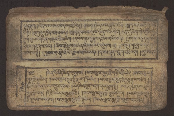 Buddhist text - Commentary on the praise of the names of Manjushri by Ga Rabjampa Kunga Yeshe Tib. 'phags pa 'jam dpal gyi mtshan yang dag par brjod pa zhugs so, unknown creator role, author. Buddhist art, Tibetan, graphic prints, Book in Tibetan pecha style, xylographic print in student script dbu can. 26 folios, recto page numbering, first verso, 2 pages missing. Buddhist commentary on the prayer of praise in honor of the names of the bodhisattva Manjushri Tib. 'jam dpal dbyang by Ga Rabjampa Kunga Yeshe Tib. sga rab 'byams pa kun dga' ye shes. Original text from the 15th century; object dated 19th century, Tibet. Graphics, width 24.6 cm, height 8.0 cm, A rectangular aged parchment or paper sheet lies flat with a worn, darker border around its edges and a crease across the middle, showing a top half and bottom half each framed by a thin dark rectangular border. Within each framed area there are several horizontal rows of dense dark hand-drawn markings that form repetitive patterned s...