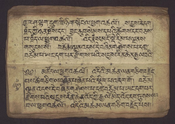 Buddhist Manuscript - Penitential Text Tib. sDig bshags gser gyi zhes bya ba bzhugs+o, unknown creator scribe-copyist, Tibetan Buddhist art, Himalayan culture, Book in Tibetan pecha style, manuscript in student's script. Leaf numbering 2-22 verso, first recto, last two unnumbered. Handwritten notes folio 24 recto and verso. 19th century, Tibet, manuscript, width 24.0 cm, height 8.1 cm, A worn rectangular sheet with a folded center showing a group of horizontal lines and decorative marks in dark black ink across its surface; the paper is an aged beige with areas of darker brown staining and smudging, especially along the edges and fold, and there are a few darker blotches and spots scattered on the page; the top and bottom edges show layered paper texture in brown tones, and a narrow dark border surrounds the sheet against a deep dark purple or nearly black background; overall visible colors include beige, brown, dark brown, black, and dark purple.