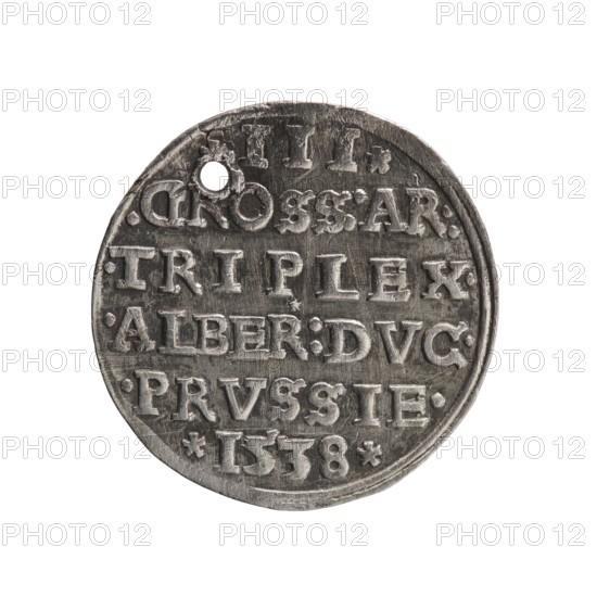 Trojak, Vogelwaider Vogelwaid, Eustachius mintmaster/publisher; Decius, Jost Ludwik fl. 1528–1535 co-creator, mint manager. Albrecht Hohenzollern Prince of Prussia; 1490–1568 — iconography: male busts in armour, stars. Obverse: male bust in armour in profile turned to the right; short hair, beard with sideburns. Inscription around the rim: *ALBER DG MAR BRAN DVX PRVSS*; continuous border, floral motifs between the words. Reverse: in the continuous border an inscription in six lines: *III*/.GROSS:AR:/.TRIPLEX./.ALBER:DVC./.PRVSSIE./*I538* 1538. Ducal Prussia 1525–1701, Königsberg mint. Coin; diameter 22.3 mm, weight 2.54 g, axis 50°., A circular metallic object with a worn silver-gray surface showing raised lettering across its face, featuring a small round hole near the top edge, a slightly irregular rim, and visible scratches and dents; the overall color palette is silver-gray with darker gray tones in recessed areas and lighter silver highlights on raised surfaces.