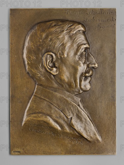 Prince Zdzislaw Lubomirski regent; Chodzinski, Kazimierz Mieczyslaw 1861–1921 medalist/author; Lopienscy, Bracia foundry; 1862–1950 co-creator; Chodzinski, Kazimierz 1861–1919. Male busts; Lubomirski, Zdzislaw 1865–1943 — iconography. Obverse: male bust in right profile, hair combed to the side, slightly curled moustache, jacket on the shoulders; inscription in three lines at top right; dated 1918; Poland, Warsaw. Plaque; dimensions: 1122 mm and 168 mm., A bronze relief plaque showing a side profile of a man's head and upper shoulders, depicted in a sculpted, raised form with detailed facial features, ear, hair, and a mustache. The figure wears a collared jacket and tie. The plaque has a textured background and visible tool marks. The colors visible are bronze tones, brown, dark brown, and hints of golden highlights, set against a neutral light gray border.