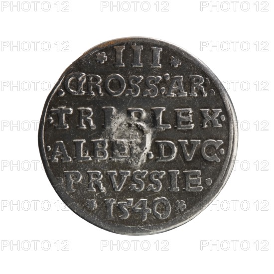 Trojak, Vogelwaider Vogelwaid, Eustachius mintmaster/publisher; Decius, Jost Ludwik fl. 1528–1535 co-creator/mint manager. Albrecht Hohenzollern Prince of Prussia; 1490–1568 — iconography: male busts in armour, stars. Obverse: male bust in armour in profile to right; short hair, beard with sideburns. Inscription around rim: *ALBER DG MAR BRAN DVX PRVSS. Continuous border, floral motifs between words. Reverse: in the continuous border an inscription in six lines: *III*.GROSS:AR:/.TRIPLEX./.ALBE.:DVC./.PRVSSIE./*I540*. Date: 1540. Place: Ducal Prussia 1525–1701, Königsberg mint. Coin; diameter 22.2 mm; weight 2.43 g; axis 170°., A round metallic coin with a worn, slightly irregular edge shown against a white background, the coin surface appearing dark gray and silver with areas of lighter silver highlights; the face shows raised, embossed shapes and patterns with a few rough, pitted spots near the center and a small circular indentation, and the overall texture appears scratched and aged...