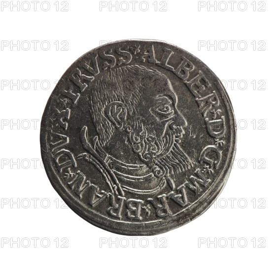 Obverse: Male bust in armour in profile turned to the right; short hair, long beard with sideburns. In the rim the inscription *ALBER DG MAR BRAN DVX PRVSS; double continuous border, floral motifs between the words. Reverse: In a double continuous border an inscription in six lines -III-.GROSS:AR:/.TRIPLEX./.ALBER:DVC./.PRVSSIE./-I54I-; the denomination and date are between the trefoil marks. Silver coin, 1541, Ducal Prussia 1525–1701, Königsberg mint. Maker: Decius, Jost Ludwik fl. 1528–1535 co-creator; publisher/mint master: Schilling, Maciej. Diameter 22.4 mm, weight 2.60 g, axis 80°., A circular metallic object with a worn, dark gray surface showing an embossed profile of a bearded man facing right, a decorative collar or armor around his neck, and a raised rim; the metal shows lighter gray highlights on raised areas and darker gray in recessed areas.