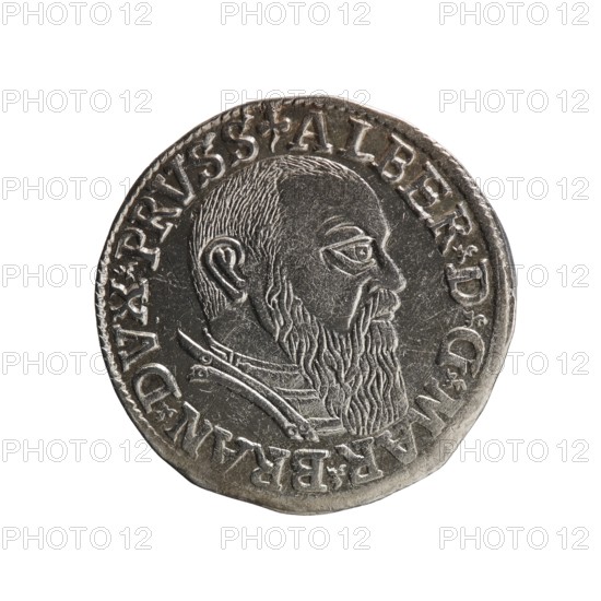 Trojak three-groschen coin by Schilling, Maciej mintmaster and co-creator Decjusz, Jost Ludwik fl. 1528–1535 mint manager. Obverse: male bust in armour in profile to right; short hair, long beard with sideburns; rim inscription beginning with a trefoil: -ALBER DG MAR BRAN DVX PRVSS; pearl border, plant motifs between words. Reverse: six-line inscription in pearl border: -III-.GROSS:AR:/.TRIPLEX./.ALBER:DVC./.PRVSSIE./-I54I- with denomination and date between trefoil marks. 1541. Ducal Prussia 1525–1701, Königsberg mint. Coin; diameter 22.6 mm, weight 2.72 g, axis 50°., A round metallic coin with a raised profile of a bearded man facing right; the man has short hair, a prominent ear, a detailed beard, and visible clothing or armor at the neck. The coin surface shows engraved decorative edging and raised lettering around the perimeter, with textured and worn areas on its face. The colors visible are silvery gray tones with darker gray shading and slight brownish or tarnished hints.