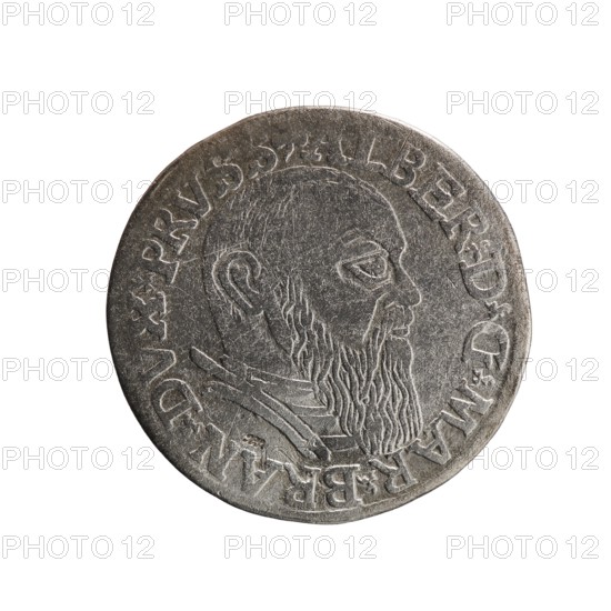 Obv.: Male bust in armour in profile turned to the right; short hair, long beard with sideburns. In the rim an inscription beginning with a trefoil: -ALBER DG MAR BRAN DVX PRVSS. Pearl border; plant motifs between the words. Rev.: In the border an inscription in six lines: -III-.GROSS:AR:/.TRIPLEX./.ALBER:DVC./.PRVSSIE./-I54I-. The denomination and date are between trefoil marks. Maker/creator: Decius, Jost Ludwik fl. 1528–1535 mint manager, co-creator; Schilling, Maciej mint master, publisher. Iconography: Albrecht Hohenzollern Prince of Prussia; 1490–1568. Date: 1541. Place: Ducal Prussia Duchy, Königsberg mint. Object: coin. Measurements: diameter 22.4 mm; weight 2.50 g; axis 60°., A circular metallic object with a worn grey surface showing the raised profile of a bearded man in side view, textured hair and beard lines, a visible ear, and a collar-like shape near the neck; the rim shows shallow raised lettering and decorative marks, and the overall color palette includes shades of g...
