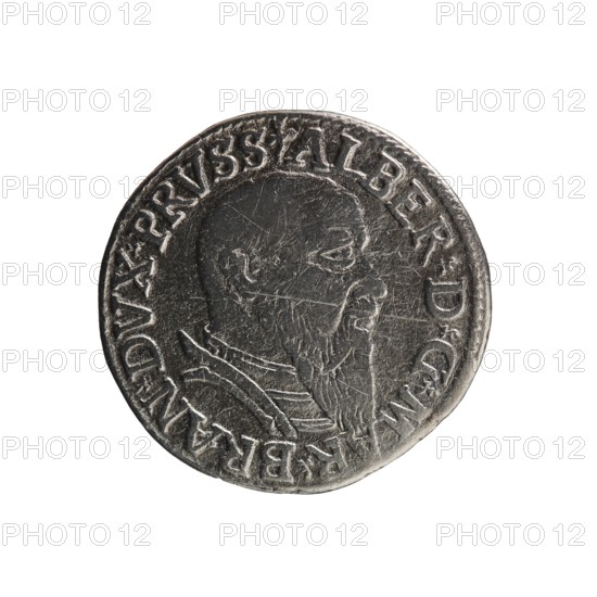 Trojak, Straub Strawb, Heinrich mintmaster/publisher; Decius, Jost Ludwik fl. 1528–1535 mint manager/co-creator. Albrecht Hohenzollern Prince of Prussia; 1490–1568 — iconography: trefoils, male busts in armour. Obverse: male bust in armour in profile facing right; short hair, long beard with sideburns. In the rim an inscription beginning with a trefoil: -ALBER DG MAR BRAN DVX PRVSS. Pearl border, plant motifs between the words. Reverse: in the pearl border an inscription in six lines: -III-.GROSS:AR:/.TRIPLEX./.ALBER:DVC./.PRVSSIE./-I54Z-. The denomination and date are between trefoil marks. Date: 1542. Place: Ducal Prussia, Königsberg mint. Coin; diameter 21.2 mm; weight 2.39 g; axis 135°., A round metallic coin with a worn raised profile of a bearded person facing right, showing facial features and a neck with clothing details; the coin's surface is textured with scratches and wear, and it has a raised rim. The visible colors are silver, gray, and darker gray tones against a white ba...