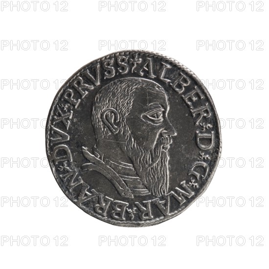 trojak; Straub Strawb, Heinrich mintmaster/publisher; Decjusz, Jost Ludwik fl. 1528–1535 mint manager/co-creator. Albrecht Hohenzollern Prince of Prussia; 1490–1568 — iconography: male busts in armour, trefoils. Obverse: male bust in armour in profile facing right; short hair, long beard with sideburns. In the rim an inscription beginning with a trefoil: -ALBER DG MAR BRAN DVX PRVSS, pearl border, plant motifs between the words. Reverse: in the pearl border an inscription in six lines: -III-.GROSS:AR:/.TRIPLEX./.ALBER:DVC./.PRVSSIE./-1542- denomination and date between trefoil marks. 1542. Ducal Prussia 1525–1701. Coin; diameter 21.3 mm; weight 2.56 g; axis 315°., A round metallic object with a raised profile of a bearded man facing right, showing a short hairline, detailed ear, prominent eye, and a long pointed beard, set against a flat background and surrounded by a raised border with decorative characters; the metal appears dark silver to gray with lighter highlights on the raised a...
