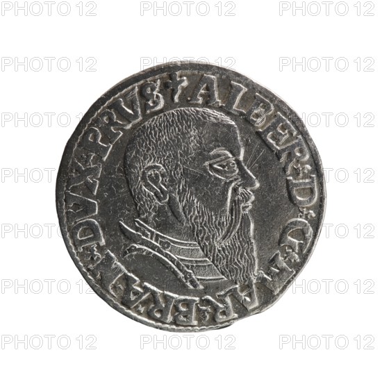 Trojak coin by Schilling, Maciej mintmaster and Decjusz, Jost Ludwik fl. 1528–1535 co-creator; Obverse: male bust in armour in profile to the right; short hair, long beard with sideburns. In the rim an inscription beginning with a trefoil: -ALBER DG MAR BRAN DVX PRVS; pearl border, plant motifs between the words. Reverse: pearl border with a six-line inscription: -III-/.GROSS:AR:/.TRIPLEX./.ALBER:DVC./.PRVSSIE./-1543- with denomination and date between trefoil marks. 1543. Ducal Prussia 1525–1701, Königsberg mint. Coin; diameter 21.2 mm; weight 2.55 g; axis 170°., A circular metallic object with a raised profile of a bearded man facing right, showing detailed hair texture and a long beard, surrounded by raised decorative edging and a ring of raised characters; the surface is silver-gray with darker gray recesses and lighter gray highlights, and the metal shows some wear and small surface scratches.