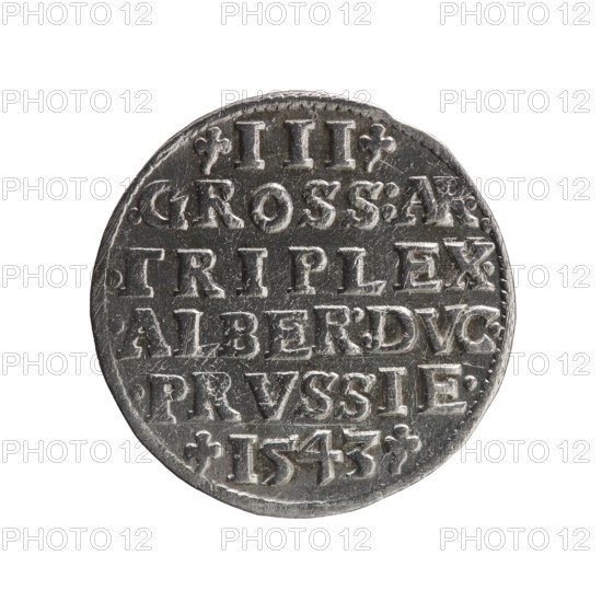 Trojak by Schilling, Maciej mintmaster and co-creator Decjusz, Jost Ludwik fl. 1528–1535, mint manager. Obverse: male bust in armour in profile facing right; short hair, long beard with sideburns; rim inscription beginning with a trefoil: -ALBER DG MAR BRAN DVX PRVS; pearl border, plant motifs between words. Reverse: six-line inscription in the pearl border: -III-/.GROSS:AR:/.TRIPLEX./.ALBER:DVC./.PRVSSIE./-I543-; denomination and date between trefoil marks. Dated 1543, Ducal Prussia 1525–1701, Königsberg mint. Coin; diameter 21.2 mm, weight 2.55 g, axis 170°., A round metallic object with a worn surface and a raised rim, showing engraved and embossed markings across its face; the object appears in shades of gray and silver with darker recessed areas and lighter highlights on raised details, and the background is white.
