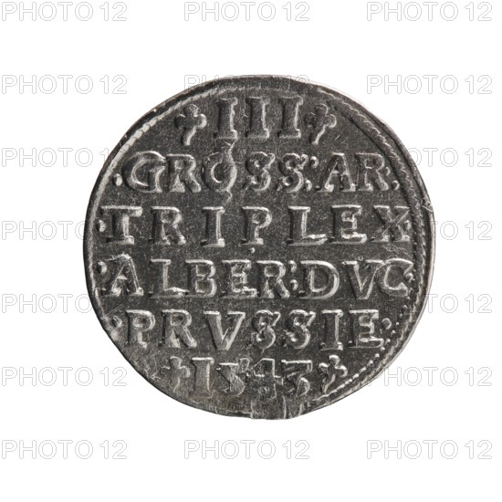 Trojak, Schilling, Maciej mintmaster; Decjusz, Jost Ludwik fl. 1528–1535 mint manager; co-creator. Albrecht Hohenzollern Prince of Prussia; 1490–1568 — iconography: trefoils, male busts in armour. Obverse: male bust in armour in profile to right; short hair, long beard with sideburns; rim inscription beginning with a trefoil: -ALBER DG MAR BRAN DVX PRVSS; pearl border, plant motifs between words. Reverse: in the pearl border an inscription in six lines: -III-/.GROSS:AR:/.TRIPLEX./.ALBER:DVC./.PRVSSIE./-I543- 1543. Ducal Prussia 1525–1701, Königsberg. Coin; diameter 21.5 mm, weight 2.61 g, axis 45°., A round metallic object with a worn surface and raised edges, showing a textured face with a series of incised rectangular shapes and decorative raised dots along the rim; the object appears mostly silver-gray with darker gray areas in recessed portions and slight brownish tarnish in some spots, and the background is plain white.