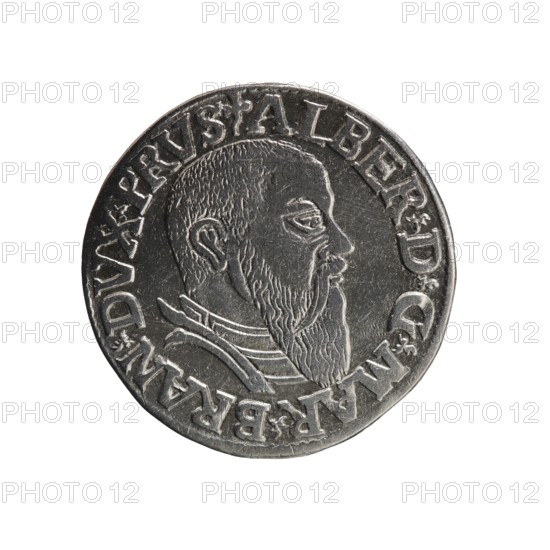 trojak, Schilling, Maciej mintmaster publisher, Decjusz, Jost Ludwik fl. 1528–1535 co-creator; mint manager, Albrecht Hohenzollern Prince of Prussia; 1490–1568 — iconography: trefoils, male busts in armour. Obv.: male bust in armour in profile turned to the right; short hair, long beard with sideburns. In the rim an inscription beginning with a trefoil: -ALBER DG MAR BRAN DVX PRVS; pearl border, plant motifs between the words. Rev.: in the pearl border an inscription in six lines: -III-/.GROSS:AR:/.TRIPLEX./.ALBER:DVC./.PRVSSIE./-I543-; the denomination and date are between trefoil marks. 1543. Ducal Prussia 1525–1701, Königsberg mint. Coin; diameter 21.0 mm, weight 2.50 g, axis 270°., A round metallic object with a raised profile of a bearded man in side view, showing textured hair, ear, eye, nose, and a long beard, along with raised decorative clothing details; the surface is shiny and reflective with worn and scratched areas; a raised border surrounds the central portrait and contai...