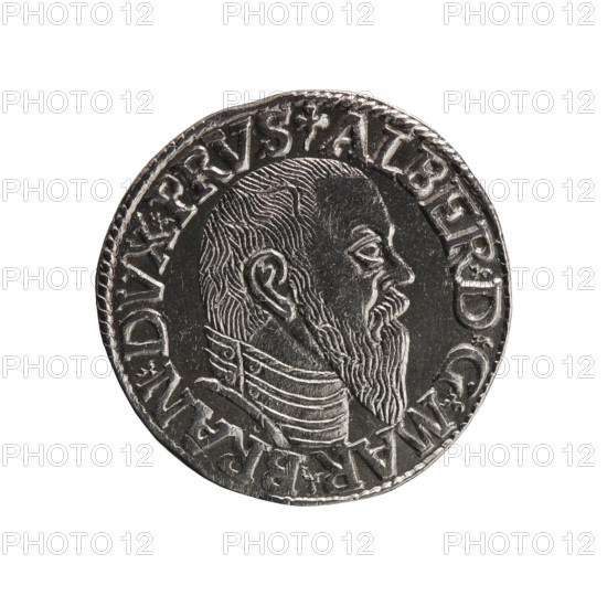 Trojak, Schilling, Maciej mintmaster; Decjusz, Jost Ludwik fl. 1528–1535 co-creator. Albrecht Hohenzollern Prince of Prussia; 1490–1568 — iconography: trefoils, male busts in armour. Obverse: male bust in armour in profile to right; short hair, long beard with sideburns; rim inscription beginning with a trefoil: -ALBER DG MAR BRAN DVX PRVS; pearl border, plant motifs between words. Reverse: pearl border with six-line inscription: -III-/.GROSS:AR:/.TRIPLEX./.ALBER:DVC./.PRVSSIE./-I544-; denomination and date between trefoil marks. Date: 1544. Place/type: Ducal Prussia 1525–1701, Königsberg mint. Object: coin trojak/schilling, diameter 21.0 mm, weight 2.44 g, axis 160°., A round metallic coin showing a raised profile of a bearded man facing right, with detailed hair and beard textures and a high-collared garment; the coin has a patterned rim and raised decorative elements around the portrait; visible colors include silver, gray, and dark gray.