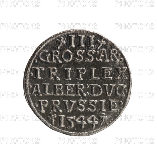 Trojak coin. Maker: Schilling, Maciej; co-creator/publisher: Decjusz, Jost Ludwik fl. 1528–1535 — mintmaster. Iconography: Albrecht Hohenzollern Prince of Prussia; 1490–1568 — trefoils, male busts in armour. Obverse: male bust in armour in profile turned to the right; short hair, long pointed beard with sideburns. In the rim an inscription beginning with a trefoil: -ALBER DG MAR BRAN DVX PRVSS, pearl border, plant motifs between the words. Reverse: in the pearl border an inscription in six lines: -III-/.GROSS:AR:/.TRIPLEX./.ALBER:DVC./.PRVSSIE./-I544- . The denomination and date are between trefoil marks. Date: 1544. Place/type: Ducal Prussia 1525–1701; Königsberg mint. Object type: coin. Diameter: 21.2 mm. Weight: 2.51 g. Axis: 320°., A round metallic coin with a worn surface and raised rim, shown against a white background; the coin appears silver-gray with darker recessed areas and lighter highlights on raised lettering and edges, showing a patina and small scratches, dents, and irr...