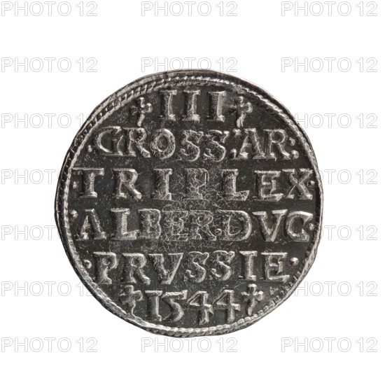 Trojak, Schilling; Maciej Schilling mintmaster; co-creator: Jost Ludwik Decjusz fl. 1528–1535; mint manager. Obverse: male bust in armour in profile to right; short hair, long beard with sideburns; rim inscription beginning with a trefoil: -ALBER DG MAR BRAN DVX PRVS; pearl border; plant motifs between words. Reverse: pearl border with six-line inscription: -III-/.GROSS:AR:/.TRIPLEX./.ALBER:DVC./.PRVSSIE./-1544-; denomination and date between trefoil marks. Dated 1544. Issued for Ducal Prussia 1525–1701, Königsberg mint. Coin; diameter 21.6 mm; weight 2.81 g; axis 220°., A round metallic coin with a textured surface and raised details, shown against a white background. The coin appears silver-gray with darker gray recessed areas creating contrast. The edge of the coin is slightly irregular and has a decorative border. The face of the coin shows a pattern of horizontal divisions and a few decorative marks, with worn and scratched areas visible on the metal.