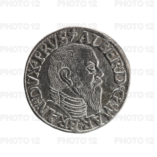 trojak; maker: Schilling, Maciej mintmaster and co-creator Decjusz, Jost Ludwik fl. 1528–1535, mint manager; iconography: Albrecht Hohenzollern Prince of Prussia; 1490–1568 — trefoils, male busts in armour. Obverse: male bust in armour in profile to right; short hair, long pointed beard with sideburns; rim inscription beginning with a trefoil: -ALBER DG MAR BRAN DVX PRVS; pearl border, plant motifs between words. Reverse: pearl border with six-line inscription: -III-/.GROSS:AR:/.TRIPLEX./.ALBER:DVC./.PRVSSIE./-I544-; denomination and date between trefoil marks. Date: 1544. Place: Ducal Prussia Duchy, Königsberg mint. Object: coin trojak; diameter 21.3 mm; weight 2.58 g; axis 220°., A round metallic coin shown against a white background with a raised profile of a bearded man facing right, detailed hair and beard texture, a pronounced ear and eye, and a high-collared garment with lined decoration; the coin's rim features raised decorative elements and an outer ring of raised characters; ...