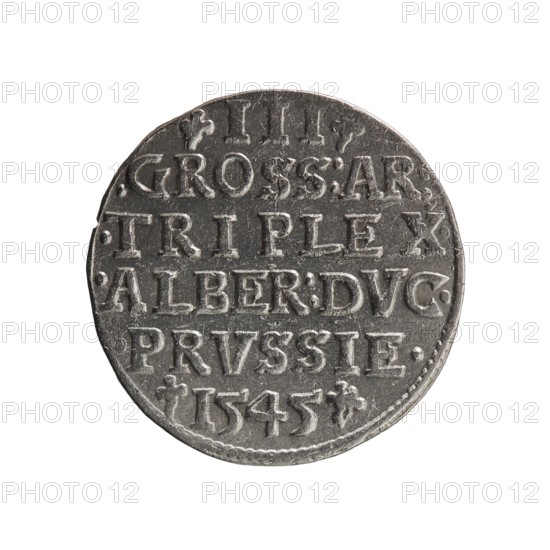trojak; maker: Schilling, Maciej mintmaster; co-creator: Decjusz, Jost Ludwik fl. 1528–1535, mint manager. Obverse: male bust in armour in profile turned right; short hair, long pointed beard with sideburns; rim inscription beginning with a trefoil: -ALBER DG MAR BRAN DVX PRVSS; pearl border, plant motifs between words. Reverse: inscription in six lines within a pearl border: -III-/.GROSS:AR:/.TRIPLEX./.ALBER:DVC./.PRVSSIE./-1545-; denomination and date between trefoil marks. Date: 1545. Place: Ducal Prussia, Königsberg mint. Coin; diameter 21.2 mm; weight 2.65 g; axis 45°., A round metallic coin with a worn, textured surface shown against a white background; the coin appears silver-gray with darker gray areas in recessed parts and lighter silver highlights on raised edges; the rim is slightly irregular and the surface shows scratches and small dents; there is a pattern of raised linear and blocky shapes arranged across the face of the coin, and decorative small floral-like marks near ...