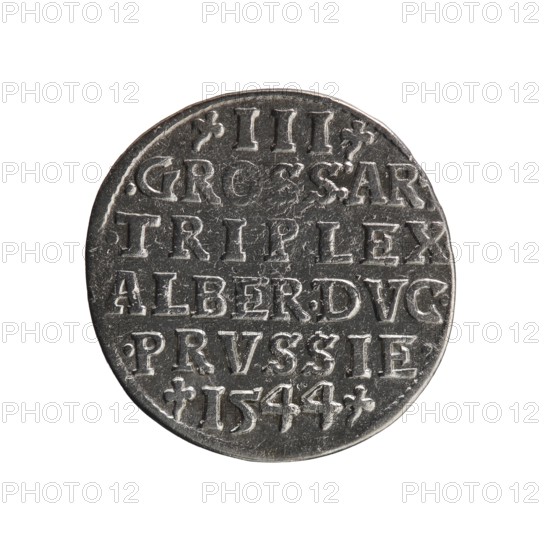 Trojak; Schilling, Maciej mintmaster; Decjusz, Jost Ludwik fl. 1528–1535 co-creator, mint manager; iconography: Albrecht Hohenzollern Prince of Prussia; 1490–1568. Obv.: male bust in armour in profile to right; short hair, long pointed beard with sideburns. In rim an inscription beginning with a trefoil: -ALBER DG MAR BRAN DVX PRVSS; pearl border, plant motifs between words. Rev.: inscription in six lines in the pearl border: -III-/.GROSS:AR:/.TRIPLEX./.ALBER:DVC./.PRVSSIE./-I544-; denomination and date between trefoil marks. 1544. Ducal Prussia 1525–1701, Königsberg mint. Coin; diameter 21.4 mm; weight 2.48 g; axis 90°., A round metallic coin with a worn surface sits against a plain white background; the coin shows a raised rim and a series of incised shapes and markings forming rows across its face, with a textured, scratched patina. Visible colors are silver-gray on the coin with darker gray shadows in recessed areas and lighter silvery highlights on raised edges, set against a whit...