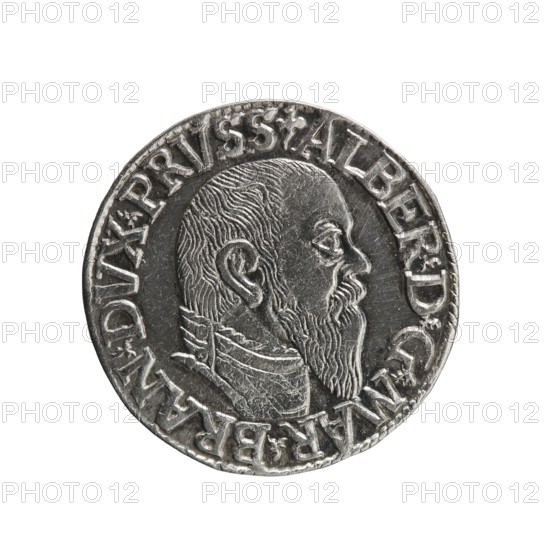 trojak; Schilling, Maciej mintmaster; Decjusz, Jost Ludwik fl. 1528–1535 co-creator; Albrecht Hohenzollern Prince of Prussia; 1490–1568 — iconography: trefoils, male busts in armour. Obv.: male bust in armour in profile turned to the right; short hair, long pointed beard with sideburns. In the rim an inscription beginning with a trefoil: -ALBER DG MAR BRAN DVX PRVSS; pearl border, plant motifs between the words. Rev.: in the pearl border an inscription in six lines: -III-/.GROSS:AR:/.TRIPLEX./.ALBER:DVC./.PRVSSIE./-I545-; the denomination and date are between the trefoil marks. 1545. Ducal Prussia 1525–1701, Königsberg mint. Coin; diameter 21.2 mm; weight 2.70 g; axis 140°., A circular metallic coin with a raised portrait of a bearded man in profile facing right, showing detailed hair and beard texture and a high collar; the coin surface is silver-gray with darker recessed areas and lighter worn highlights, and a ring of raised decorative elements and shapes around the edge.