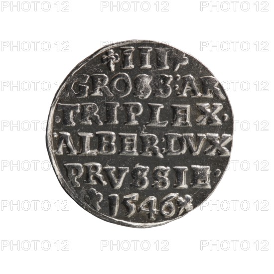 Trojak by Maciej Schilling mintmaster, co-creator; obverse: male bust in armour in profile to right, short hair, long pointed beard with sideburns; rim inscription beginning with a trefoil: -ALBER*D*G*MAR*BRAN*DVX*PRV; pearl border. Reverse: continuous border inscription in six lines: -III-/.GROSS:AR:/.TRIPLEX./.ALBER:DVC./.PRVSSIE./-I546- with denomination and date between trefoil marks. 1546. Ducal Prussia 1525–1701, Königsberg mint. Coin; diameter 21.2 mm; weight 2.66 g; axis 200°., A circular metallic object with a reflective silver-gray surface showing a textured, slightly irregular edge, featuring a series of raised, blocky shapes arranged in horizontal rows across its face; the object sits against a plain white background and displays areas of light and dark contrast where highlights and shadows emphasize the raised shapes and textured surface.
