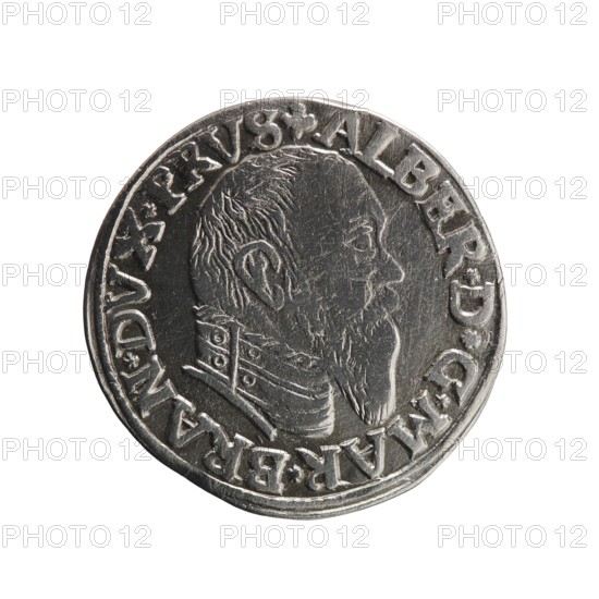 Trojak, Schilling, Maciej mintmaster; co-creator. Albrecht Hohenzollern Prince of Prussia; 1490–1568 — iconography: trefoils, male busts in armour. Obverse: male bust in armour in profile turned right; short hair, long pointed beard with sideburns. In the rim an inscription beginning with a trefoil: -ALBER*D*G*MAR*BRAN*DVX*PRVS; pearl border. Reverse: continuous border inscription in six lines: -III-/.GROSS:AR:/.TRIPLEX./.ALBER:DVC./.PRVSSIE./-I546-; the denomination and date are between the trefoil marks. 1546. Ducal Prussia 1525–1701. Königsberg mint. Coin; diameter 21.9 mm; weight 2.51 g; axis 270°., A round metallic coin with a raised profile of a bearded man facing right, showing detailed hair and facial features and wearing a decorated collar; the coin has a raised rim and an outer band with raised characters around the edge; visible colors include silver, gray, and darker metallic tones, with highlights and slight scratches on the surface.