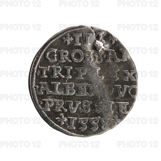 trojak, towers, Albrecht Hohenzollern Prince of Prussia; 1490–1568 - iconography, male busts in armor. Obverse: male bust in armor in profile turned to the right; short hair, long pointed beard with sideburns. In the rim an inscription beginning with a tower: -ALBER.DGMAR.BRAN.DVX.PRVSS; continuous border. Reverse: in the pearl border an inscription in six lines: +III+/GROSS.AR/.TRIPLEX/.ALBER DVC /.PRVSSIE./+I558+. Denomination and date between lilac crosses, 1558. Ducal Prussia 1525–1701, Königsberg; coin. Diameter 21.3 mm, weight 2.42 g, axis 0°., A round metal coin with a worn and uneven surface, showing a few dents and a small hole near the edge; the coin appears primarily silver-gray with darker gray areas in the recessed parts and lighter silver highlights on raised surfaces; a group of incised shapes and carved details form rows across the face but no text should be described; the coin edge is slightly irregular and the background is plain white.