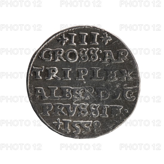 Trojak, Albrecht Hohenzollern Prince of Prussia; 1490–1568 — iconography: towers, male busts in armor. Obverse: male bust in armor in profile facing right; short hair, long pointed beard with sideburns. In the rim an inscription beginning with a tower — ALBE... G. MAR. BRAN. DVX. PRVSS — pearl border. Reverse: in the pearl border an inscription in six lines: +III+/GROSS:AR./.TRIPLEX/.ALBER.DVC/PRVSSIE./+I558 Denomination and date between lilac crosses, 1558. Ducal Prussia 1525–1701, Königsberg; coin. Diameter 21.4 mm, weight 2.52 g, axis 140°., A round metallic object with a worn surface photographed against a white background; the object appears dark silver to gray with lighter silver highlights on raised areas, showing irregular edges and surface scratches; the top shows a few decorative indented shapes and the face features several horizontal bands of raised lettering-like grooves and impressions, with some areas appearing more worn or smoothed, and a subtle shadow around the lower ...