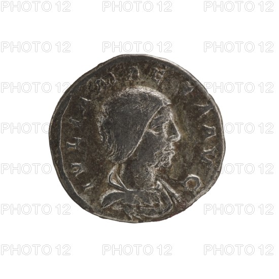 Denarius, Elagabalus 204–222; Roman emperor 218–222. Obv.: IVLIA MAESA AVG — Draped bust of Julia Maesa facing right, pearl border. Rev.: PVDICITIA — Pudicitia with a veil on her head seated on a throne facing left, lifting the hem of her veil with her right hand and holding a scepter in her left, pearl border. Rome, 218–223. Coin; diameter 19.5 mm; weight 3.50 g., A round metallic object with a worn, dark gray surface and lighter gray highlights showing a raised profile of a person wearing a close-fitting head covering and a draped garment, set against a plain white background; the object shows uneven edges, surface scratches, and areas of lighter silvery sheen along the raised features and rim.