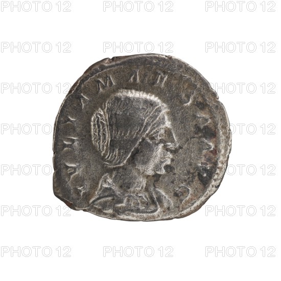 Denarius, Elagabalus r. 218–222. Obverse: Draped bust of Julia Maesa facing right, pearl rim; inscription IVLIA MAESA AVG. Reverse: Veiled Pudicitia seated on a throne facing left, raising the hem of her veil with her right hand and holding a scepter in her left; inscription PVDICITIA. Roman Empire, struck Rome, 218–223. Coin; diameter ~17.5–18.5 mm; weight 3.30 g., A worn circular metallic object with an uneven edge showing a raised profile of a person's head facing right, featuring stylized hair pulled back and draped clothing around the neck; the surface shows areas of wear and texture variations with small pits and scratches. Colors visible include shades of gray, dark gray, silver, and hints of brownish discoloration.