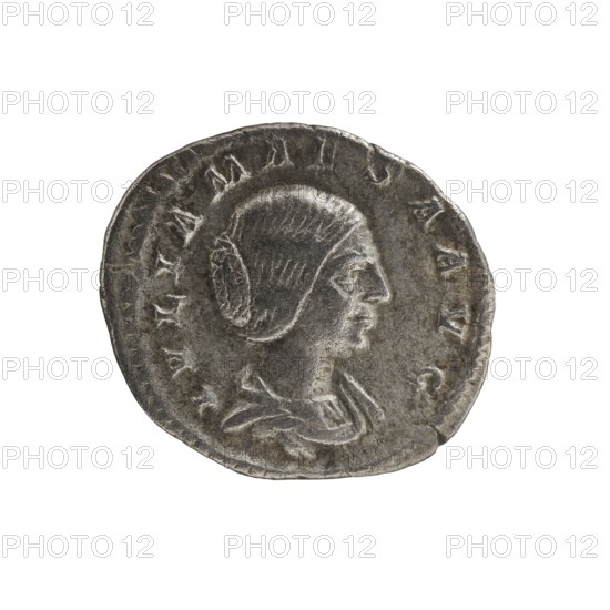 Denarius of Elagabalus 204–222; Roman emperor 218–222. Obverse: IVLIA MAESA AVG — Draped bust of Julia Maesa facing right, pearl border. Reverse: PVDICITIA — Veiled Pudicitia seated on a throne facing left, raising the hem of her veil with her right hand and holding a scepter in her left, pearl border. Rome, 218–223. Coin; diameter ~17.0–19.5 mm; weight 2.65 g., A round, worn metallic coin with a raised profile of a person facing right; the person appears to have hair arranged in a bun and is wearing draped clothing. The coin surface is textured and uneven with several raised ridges and indentations along the edge. The visible colors are shades of silver and gray with darker gray toning in recessed areas and lighter silver highlights on raised portions.