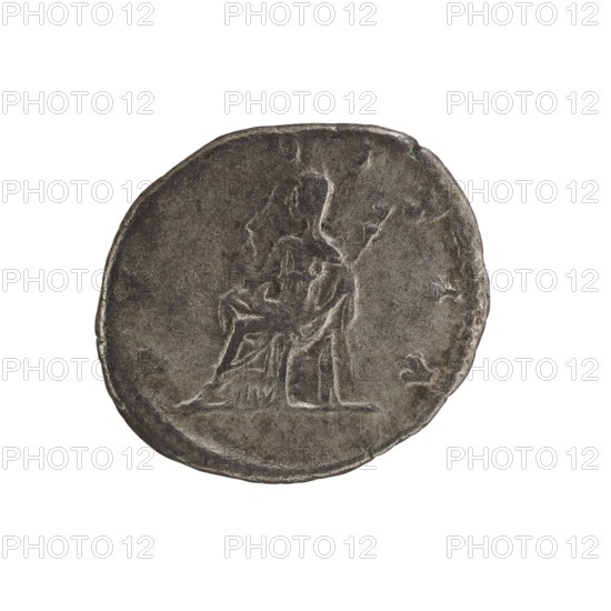 Denarius, Elagabalus Roman emperor 218–222. Obv.: IVLIA MAESA AVG — Draped bust of Julia Maesa facing right, pearl border. Rev.: PVDICITIA — Veiled Pudicitia seated on a throne facing left, raising the hem of her veil with her right hand and holding a scepter in her left, pearl border. Coin dated 218–223, Rome; diameter ~17.0–19.5 mm, weight 2.65 g., A round, worn metallic coin with a dark gray surface showing a raised, faint relief of a seated human figure holding a long object; the figure and surrounding field are textured with wear and small irregularities, and the coin edge is uneven and slightly dented.