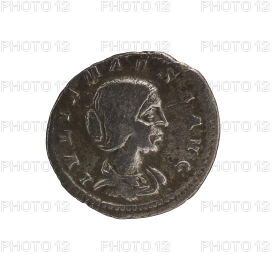 Denarius, Elagabalus Roman emperor 218–222. Obverse: IVLIA MAESA AVG — draped bust of Julia Maesa facing right, pearl border. Reverse: PVDICITIA — veiled Pudicitia seated on a throne facing left, raising the hem of her veil with her right hand and holding a scepter in her left, pearl border. Date: 218–223. Place of origin: Rome. Material: coin. Diameter: 17.5–19.0 mm. Weight: 2.45 g., A round metallic coin with a worn, dark gray surface and lighter gray highlights showing a raised profile of a person facing right; the profile includes a stylized hairstyle pulled back and a visible ear, a defined nose and chin, and a suggestion of clothing at the neck. The coin edge is irregular with a beaded inner border and areas of slight corrosion and patina in brownish tones. The background around the coin is plain white.