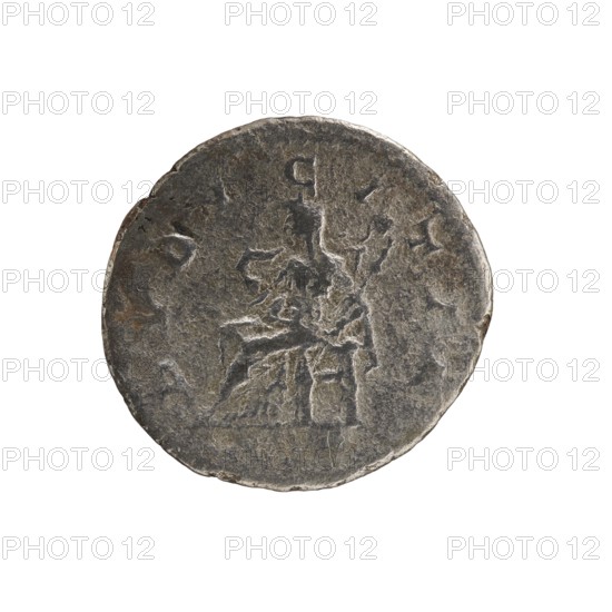 denarius, Elagabalus 204–222; Roman emperor 218–222. Obv.: IVLIA MAESAA AVG — Draped bust of Julia Maesa facing right, pearl border. Rev.: PVDICITIA — Veiled Pudicitia seated on a throne facing left, raising the hem of her veil with her right hand and holding a scepter in her left, pearl border. 218–223, Rome; coin; diameter 17.5–18.5 mm; weight 2.60 g., A round, worn coin with an uneven surface and rough edge, shown against a white background; the coin appears mostly gray with darker and lighter gray variations and a few small areas of brownish patina, and its face shows shallow, eroded relief suggesting a central seated figure and surrounding shapes but with little crisp detail.