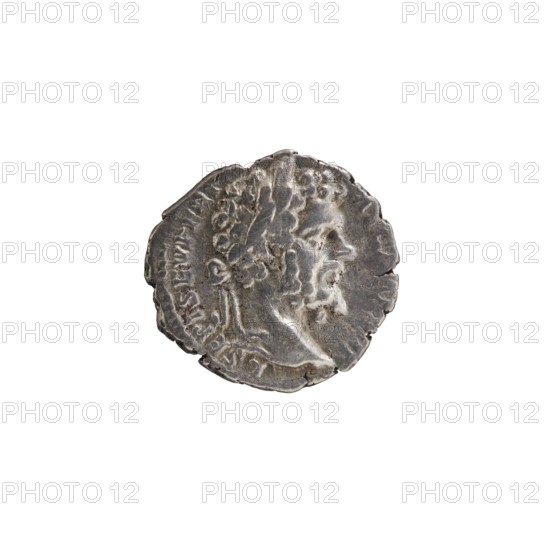 Denarius unofficial, Septimius Severus 146–211; Roman emperor 193–211, issuer: emperor. Obverse: Head of Septimius Severus with a laurel wreath facing right, legend L SEPT SEV PERT - AVG IMP VIII. Reverse: The emperor in a long robe and veil stands frontally with his head turned left, holding a patera above a tripod in his right hand and a scroll in his left, legend VOTA P - VBLICA. Iconography: tripod, paterae, scrolls. Date: 196–197 for the original. Roman Empire 27 BC–476; place of issue: Rome . Coin, diameter 17.0–18.5 mm, weight 2.65 g, axis 0°., A worn round metallic object with an uneven edge, showing a raised profile of a person in relief facing right; the surface has textured areas and small pits, with darker and lighter silvery gray tones and traces of brownish discoloration.