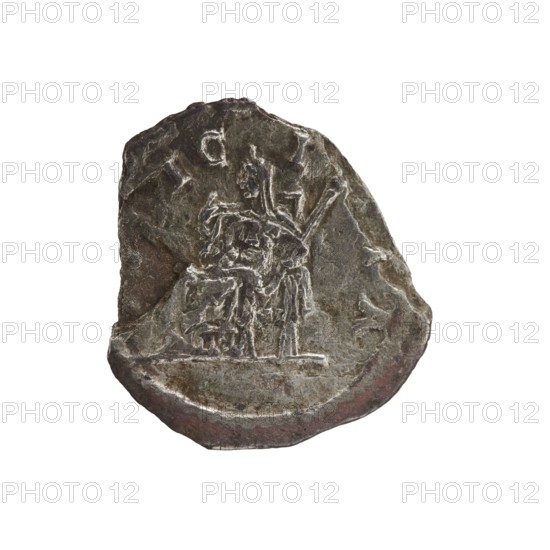 Denarius of Elagabalus 204–222; Roman emperor 218–222. Obverse: IVLIAMAESAAVG — Draped bust of Julia Maesa facing right, pearl border. Reverse: PVDIC ITIA — Veiled Pudicitia seated on a throne facing left, raising the hem of her veil with her right hand and holding a scepter in her left, pearl border. Date: 218–223. Place of origin: Rome, Roman Empire 27 BC–476. Object: coin denarius, diameter ca. 17.0–18.5 mm, weight 1.85 g., A worn, irregularly shaped metal object with a rough, pitted surface showing a carved scene in low relief; the carving depicts a seated figure next to another standing figure with elongated, angular limbs and draped clothing, both set on a slightly raised base line. The object displays a range of muted colors including dark gray, brown, and hints of greenish and reddish tones, with lighter silvery highlights along raised edges and carved lines. The edges are uneven and chipped, and the surface shows scratches and areas of smoother wear. The background around the ...